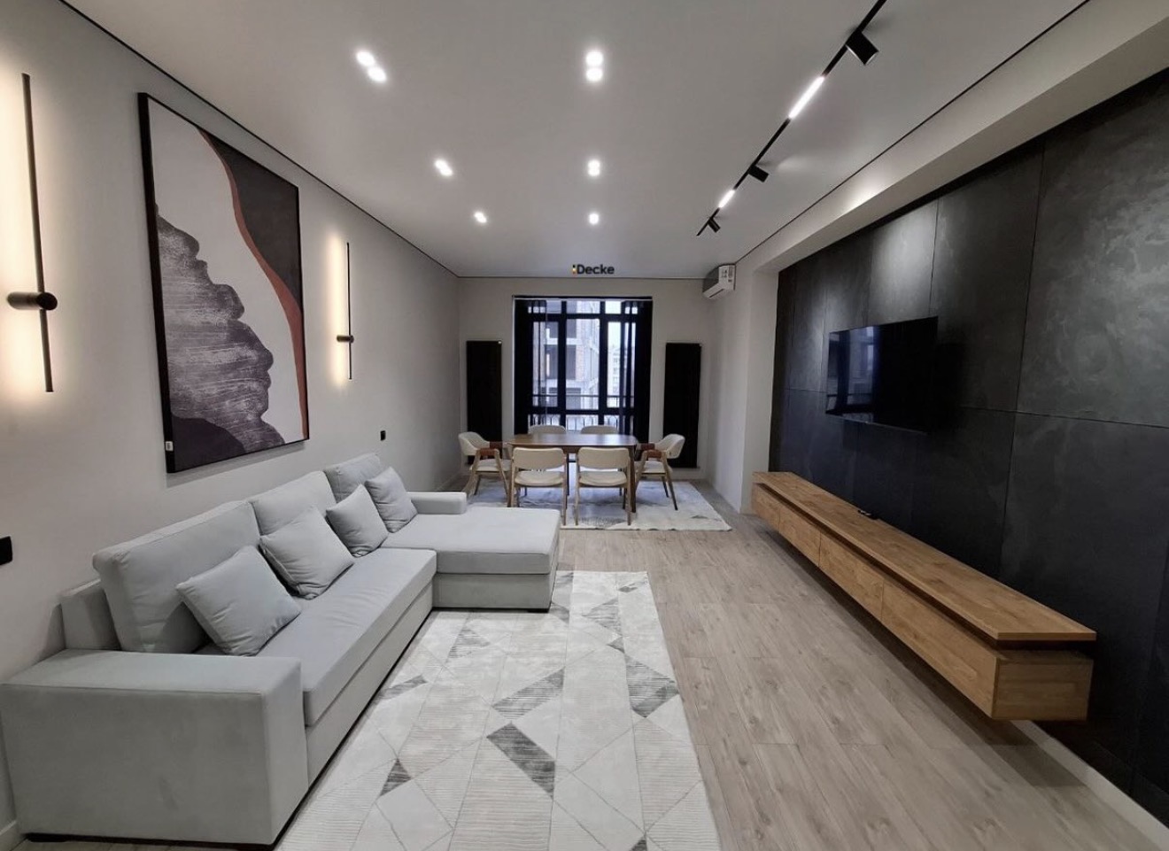 After — clean white stretch ceiling with recessed lighting